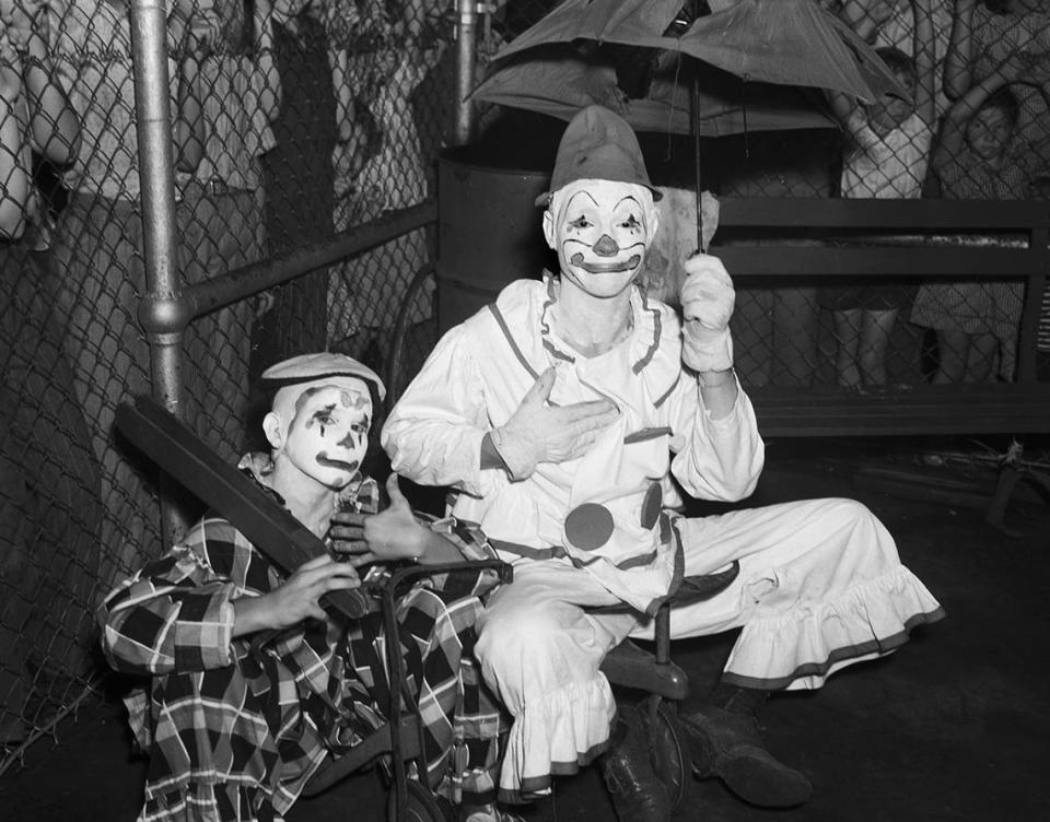 Aug. 17, 1940: The Forest Park Zoo celebrated the birthday of their elephant, “Queen Tut.” Two people dressed as clowns are participating in birthday celebration.