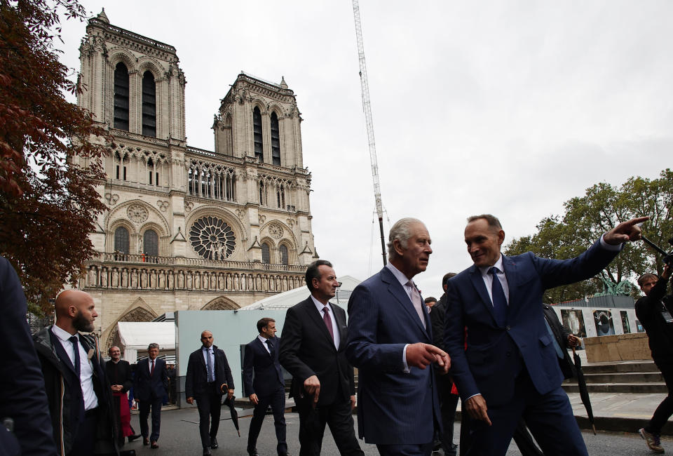 FILE - Britain's King Charles III, second right, pays a visit to the Notre-Dame de Paris Cathedral rebuilding site in Paris, Sept, 21 2023. King Charles III is on the comeback trail. The 75-year-old British monarch will slowly ease back into public life after a three-month break to focus on his treatment and recuperation after he was diagnosed with an undisclosed type of cancer. (Christophe Petit Tesson/Pool via AP, File)