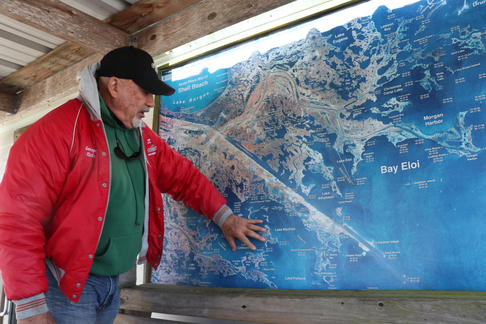 Capt. George Ricks views a map of the Louisiana bayou in St. Bernard Parish. (Photo: Rocky Kistner)