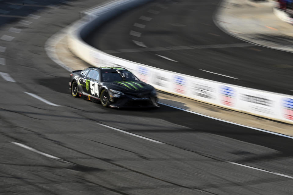 Ty Gibbs (54) steers through Turn 1 during the NASCAR All-Star Open Cup Series auto race at North Wilkesboro Speedway, Sunday, May 21, 2023, in North Wilkesboro, N.C. (AP Photo/Matt Kelley)