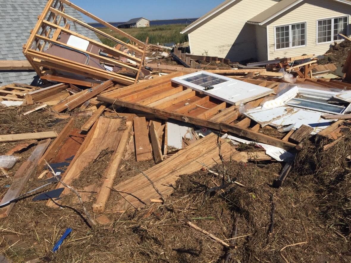 A cottage on P.E.I.'s north shore that was flattened by post-tropical storm Fiona in late September. The storm caused widespread damage and knocked out power  to the entire Island.  (Brian McInnis/The Canadian Press - image credit)