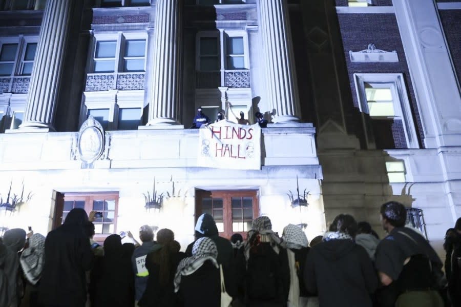 NEW YORK, UNITED STATES – APRIL 30: A group of Columbia University students, advocating for Palestinians, access the iconic Hamilton Hall building as they gather to stage a demonstration at the campus in New York, United States on April 30, 2024. Protests are sweeping college campuses across the US following a police attempt to clear a pro-Palestinian encampment at Columbia University, resulting in the arrest of over 100 students. Columbia University asked students on Monday to ‘voluntarily disperse’ amid stalled talks, threatening the students with suspension. (Photo by Lokman Vural Elibol/Anadolu via Getty Images)