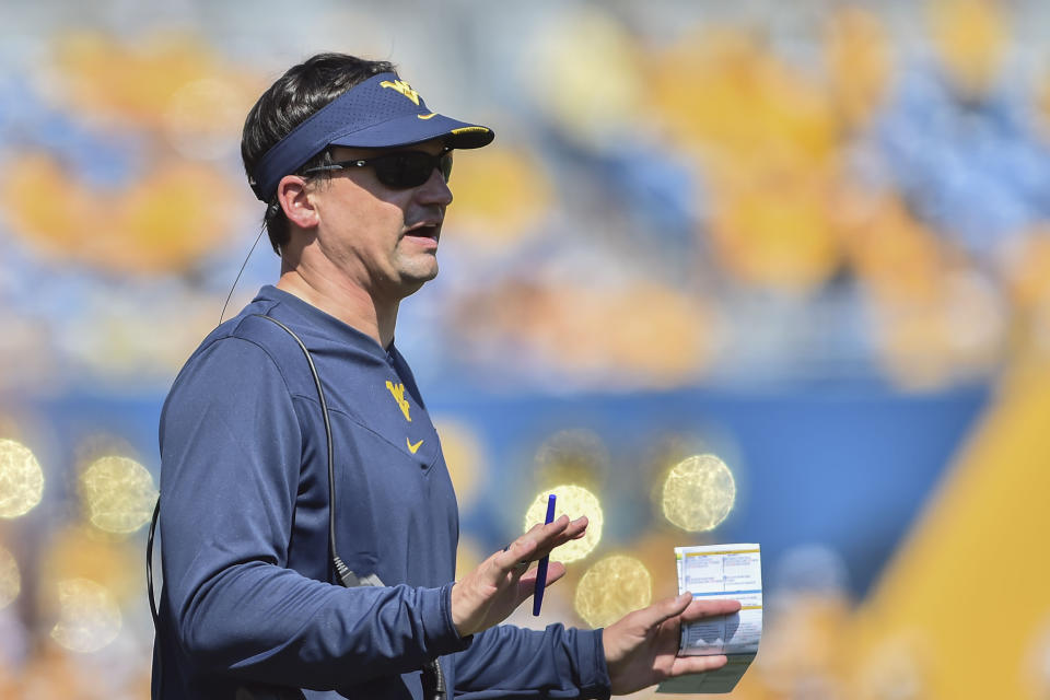 FILE - West Virginia head coach Neal Brown reacts during the first half of an NCAA college football game against Virginia Tech in Morgantown, W.Va., Saturday, Sept. 18, 2021. The Backyard Brawl returns after a 10-year hiatus on Thursday night when 17th-ranked Pitt hosts West Virginia. (AP Photo/William Wotring, File)