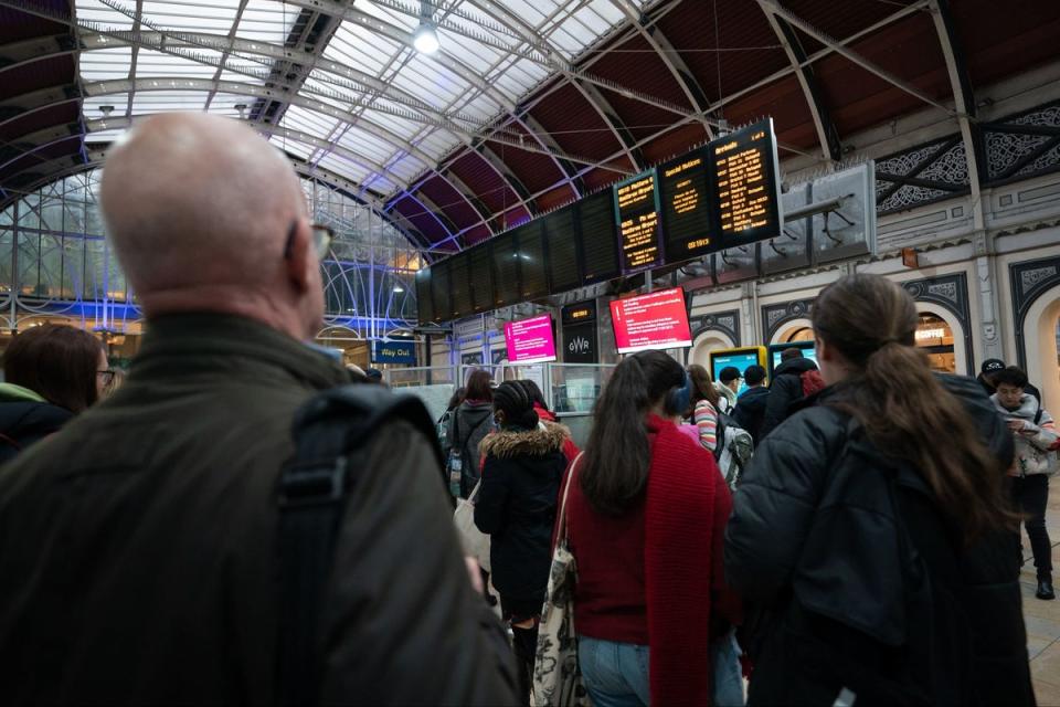 Passengers at Paddington station as rail services at the UK's second busiest station are suspended after a person was struck by a train (PA)