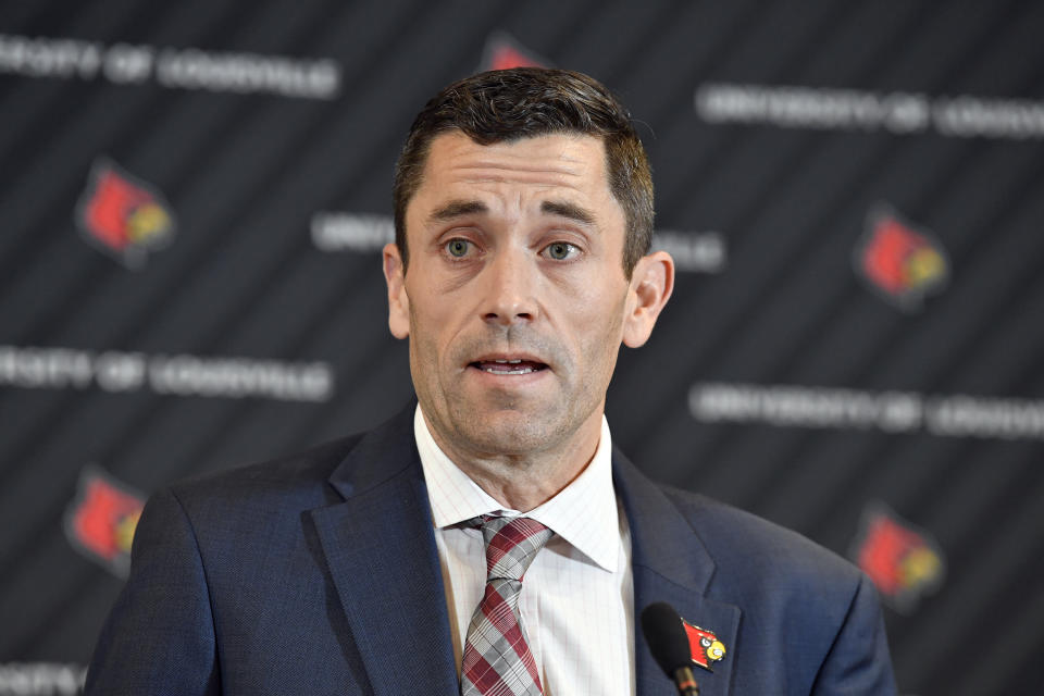 University of Louisville interim athletic director Josh Heird speaks to reporters following a meeting of the University Board of Trustees and the Louisville Athletic Association board, Wednesday, Jan. 26, 2022, in Louisville, Ky. The university and men’s basketball coach Chris Mack have mutually agreed to part ways, the school announced. Assistant Mike Pegues has been named interim coach for the remainder of the Cardinals' season. (AP Photo/Timothy D. Easley)