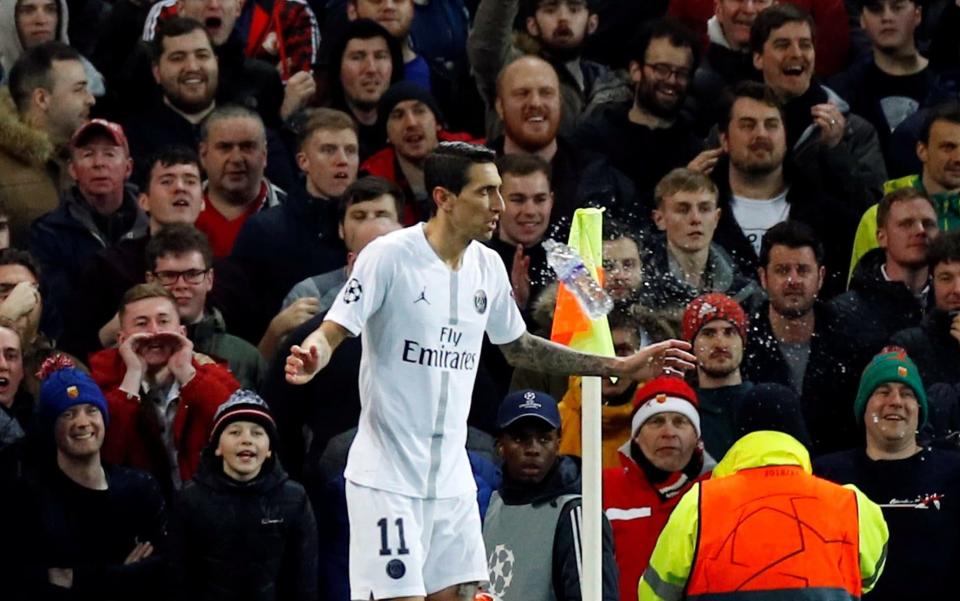 A water bottle is thrown at Angel Di Maria during PSG's 2-0 win at Old Trafford - REUTERS