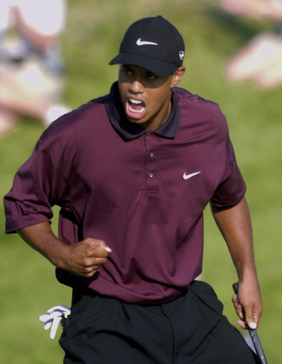FILE - Tiger Woods celebrates making birdie on the last of regulation play to tie Bob May at 18 under-par and force a playoff at the PGA Championship on Aug. 20, 2000, at Valhalla Golf Club in Louisville, Ky. Valhalla will be hosting the PGA Championship for the fourth time May 16-19, 2024. (AP Photo/Rob Carr, File)