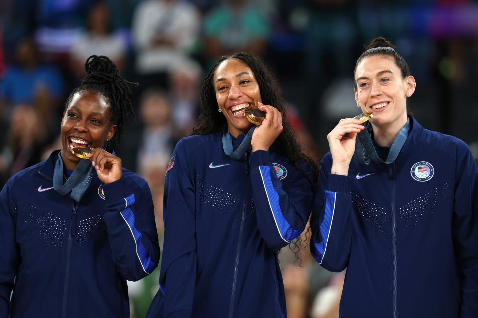 PARIS, FRANCE - AUGUST 11: Gold medalists Chelsea Gray, A'Ja Wilson, and Breanna Stewart of Team United States pose for a photo on the podium during the Women's basketball medal ceremony on day sixteen of the Olympic Games Paris 2024 at Bercy Arena on August 11, 2024 in Paris, France. (Photo by Gregory Shamus/Getty Images) ORG XMIT: 776138675 ORIG FILE ID: 2166341374