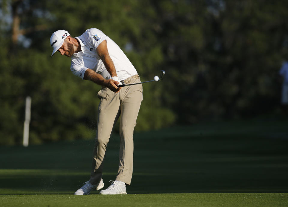 Dustin Johnson hits from the fifth fairway during a practice round for the PGA Championship golf tournament at Bellerive Country Club, Wednesday, Aug. 8, 2018, in St. Louis. (AP Photo/Charlie Riedel)