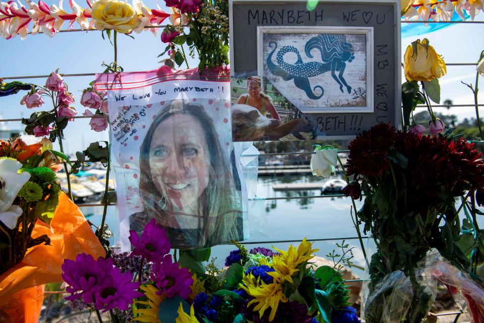Photographs of loved ones lost in the fire on the scuba dive boat Conception are placed at a memorial on the Santa Barbara Harbor on Sept. 4, 2019, in Santa Barbara, Calif. The fire killed 34 people and the trial against Conception Capt. Jerry Boylan began in federal court in Los Angeles on Tuesday, Oct. 24, 2023.