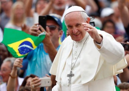 FILE PHOTO: Pope Francis waves as he arrives to lead the Wednesday general audience in Saint Peter's square at the Vatican, September 19, 2018. REUTERS/Max Rossi