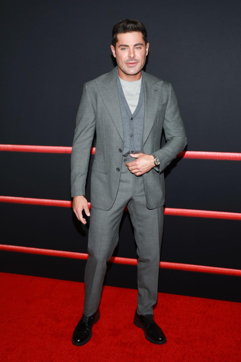 Zac Efron in grey suit at "The Iron Claw" premiere