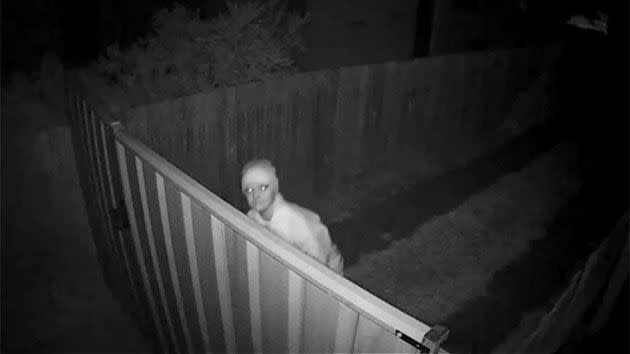 The man ducks as soon as he realises he is staring straight down the barrel of a security camera. Photo: ACT Police