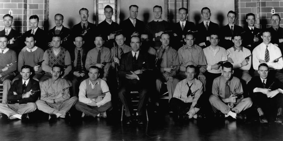 A group of FBI agents display their revolvers while training at Quantico, Virginia.