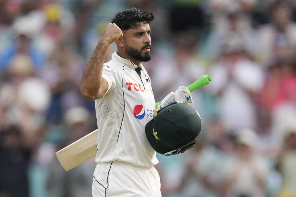 Pakistan's Aamer Jamal celebrates making 50 runs against Australia during their cricket test match in Sydney, Wednesday, Jan. 3, 2024. (AP Photo/Rick Rycroft)