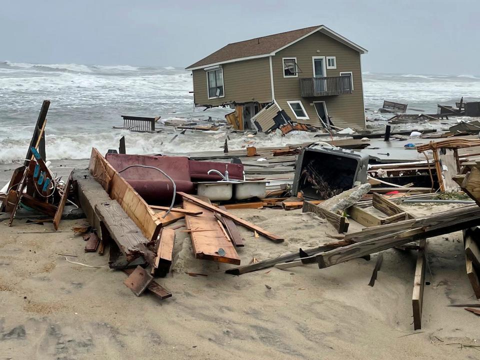 A beach house that collapsed on a beach along North Carolina's Outer Banks