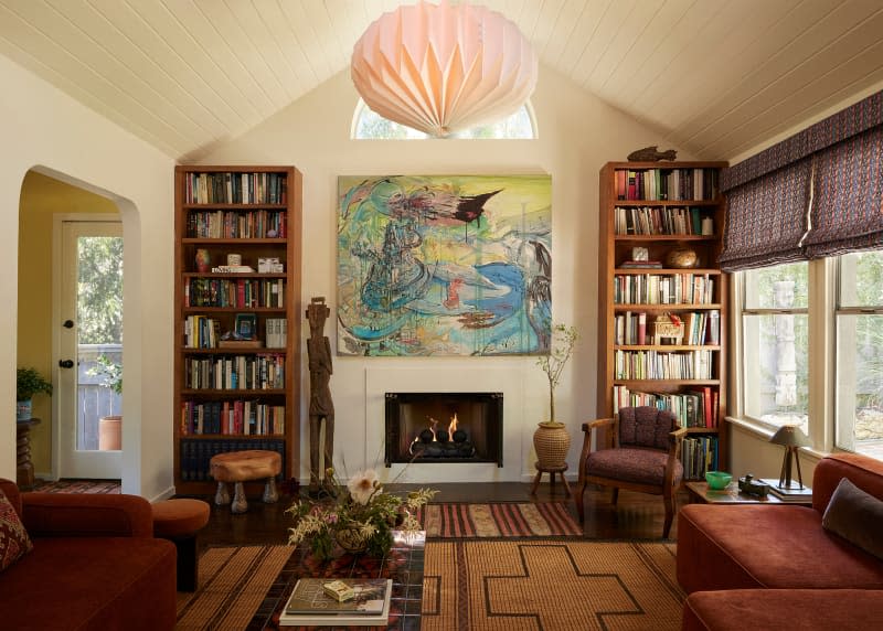 Paper pendant hanging in eclectic living room.