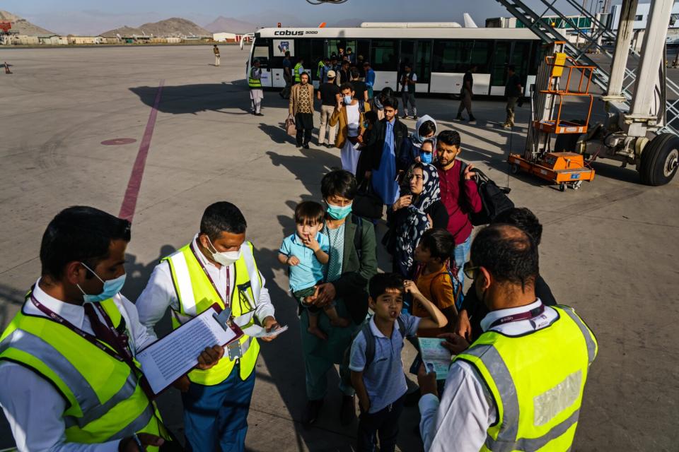 A line of people at an airport