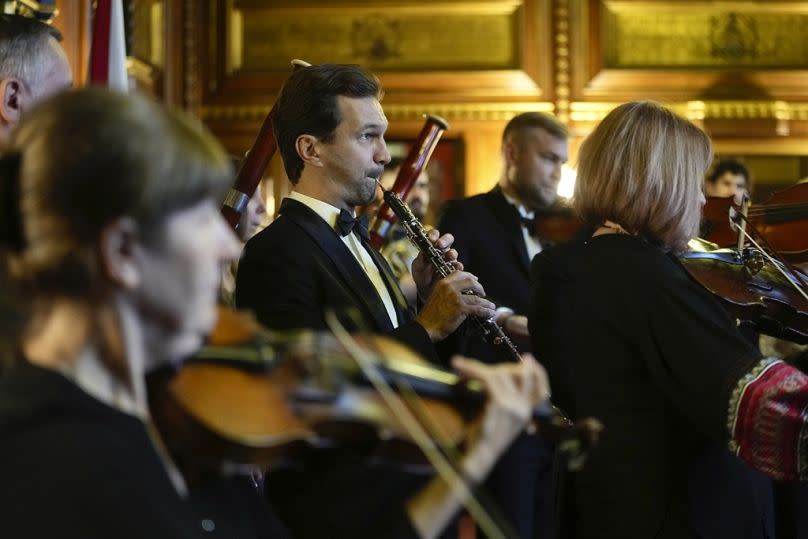 Musicians from the national Symphony Orchestra of Ukraine play an impromptu concert at Speakers House, in London, 18 October 2023