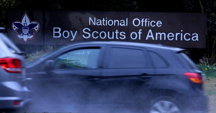 Cars drive past the Boys Scouts of America headquarters in Irving, Texas, Wednesday, Feb. 12, 2020.