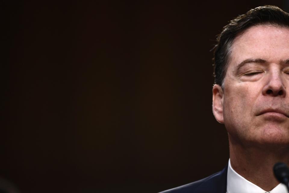 Comey pauses for a moment during the hearing.