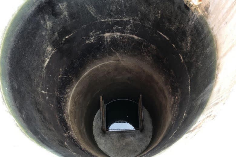 The 12m-deep well that Corporal Kok Yuen Chin Kok was being pushed into during the ragging incident, which led to his death. (PHOTO: SCDF)