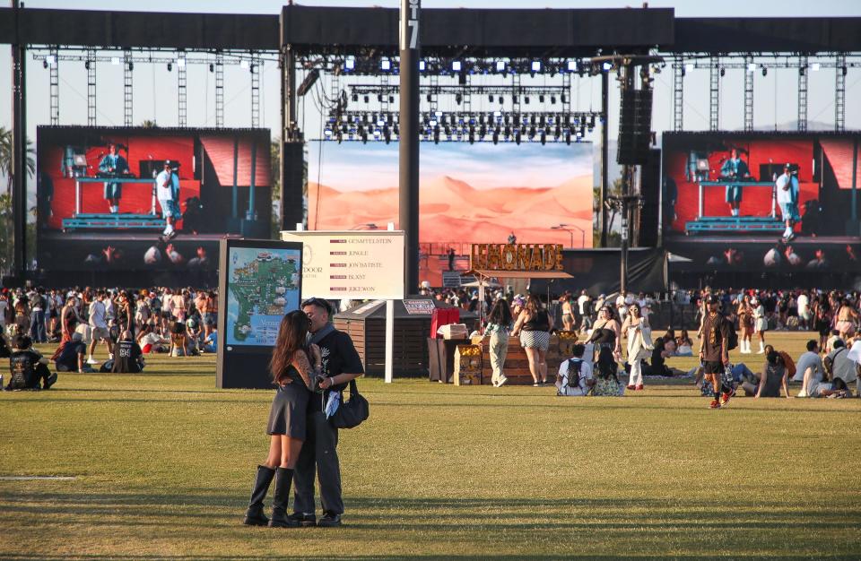 Festivalgoers enjoy the Outdoor Theatre during the second weekend of the Coachella Valley Music and Arts Festival in Indio, Calif., April 20, 2024.