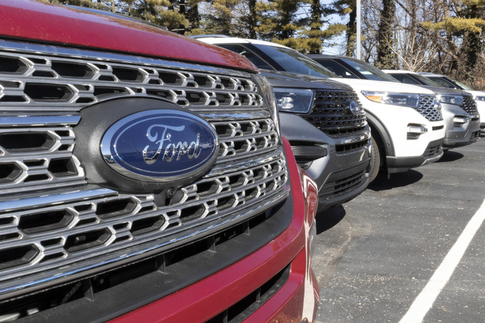 Indianapolis - Circa March 2021: Ford SUV display at a dealership. Ford sells traditional gasoline, electric and hybrid SUV models.