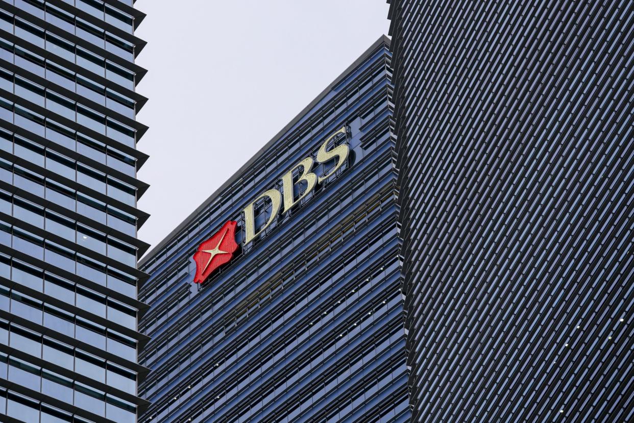The DBS Group Holdings Ltd. logo is displayed atop Tower 3 of the Marina Bay Financial Centre in Singapore, on Wednesday, Feb. 12, 2020. (Ore Huiying/Bloomberg)