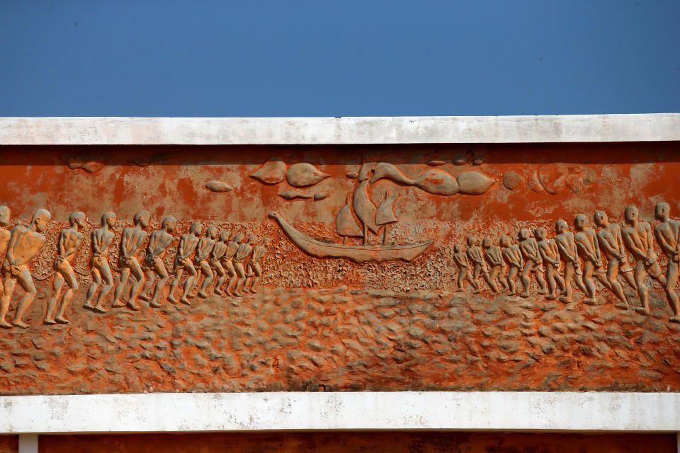 Detail of an illustration of lines of chained slaves walking towards a ship is seen at a monument at the site of the 'Point of No Return'  in the historic slave port of Ouidah, Benin. (Photo: Afolabi Sotunde/Reuters)