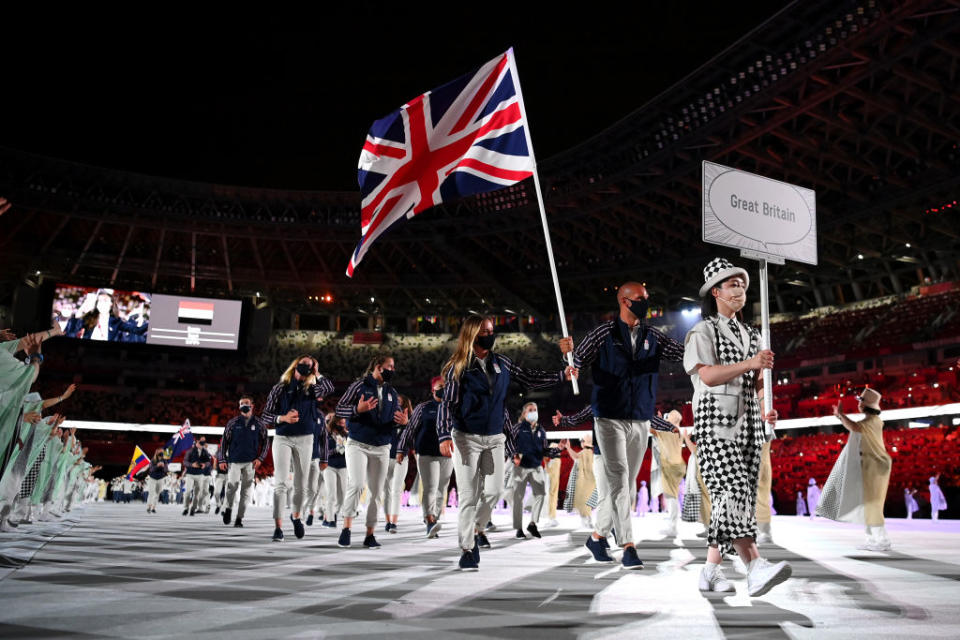 Flag bearers Hannah Mills and Mohamed Sbihi of Team Great Britain leads their team out during the Opening Ceremony of the Tokyo 2020 Olympic Games at Olympic Stadium on July 23, 2021 in Tokyo, Japan.<span class="copyright">Matthias Hangst—Getty Images</span>