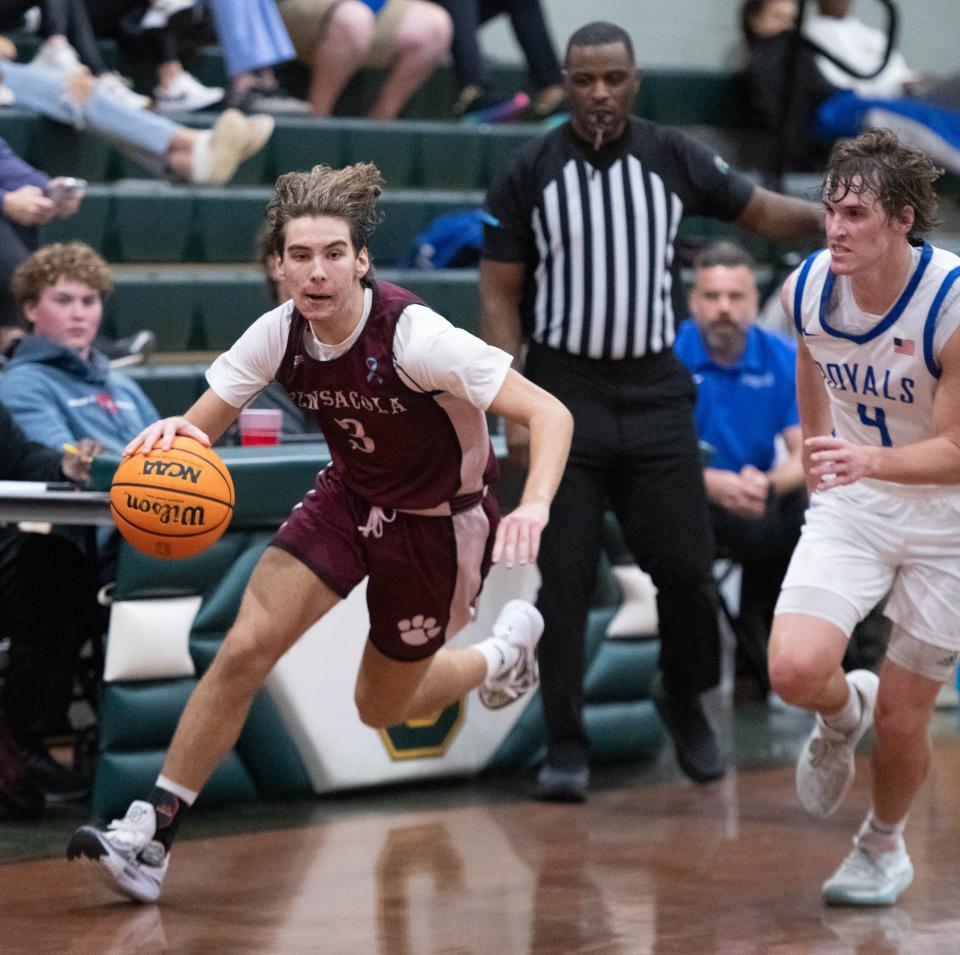 Zac Clarke (3) brings the ball up the court during the Pensacola vs Jay high school basketball game in the Esca-Rosa Challenge at Pensacola Catholic High School on Tuesday, Nov. 21, 2023.