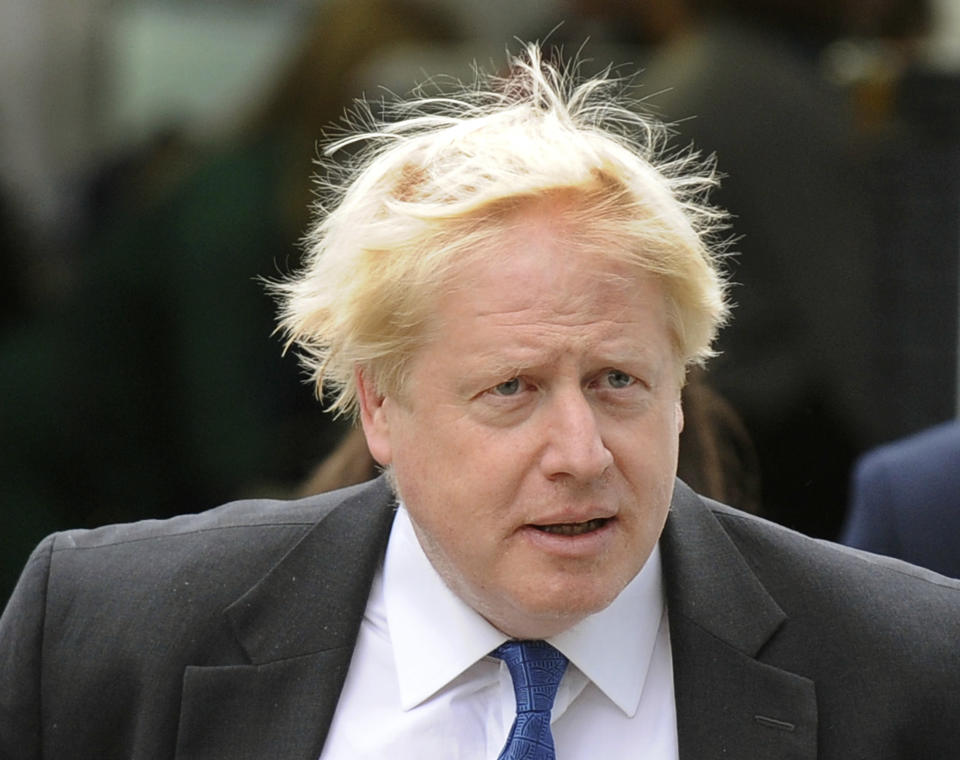 Conservative MP Boris Johnson arrives at the Conservative Party Conference at the ICC, in Birmingham, England, Tuesday Oct. 2, 2018. He's not a member of the government and he's not speaking on the main stage, but Boris Johnson is a star at Britain's Conservative Party conference. (AP Photo/Rui Vieira)