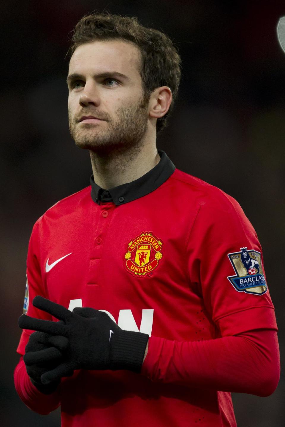 Manchester United's new signing Juan Mata starts as his team face Cardiff City in their English Premier League soccer match at Old Trafford Stadium, Manchester, England, Tuesday Jan. 28, 2014. (AP Photo/Jon Super)