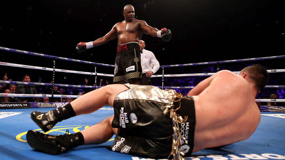 Dillian Whyte (back) knocks down Joseph Parker during their prior to his WBC Silver Heavyweight title and WBO International Heavyweight title at the O2 Arena, London. (Photo by Nick Potts/PA Images via Getty Images)