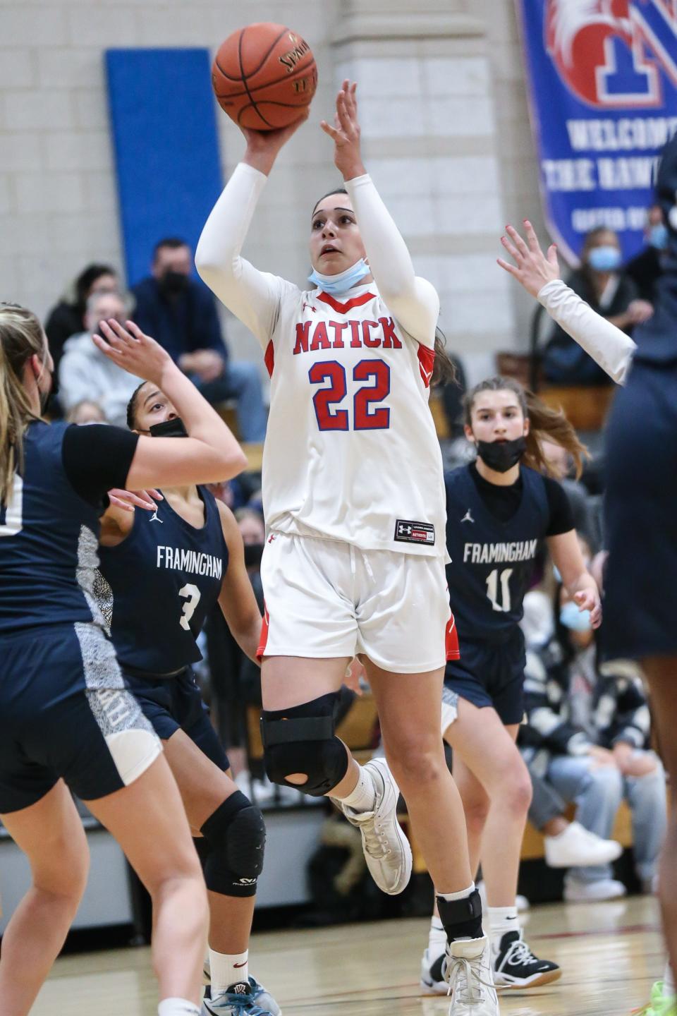 Natick junior captain Madi Forman shoots a floater during the girls basketball game against Framingham at Natick High School on Dec. 22, 2021.