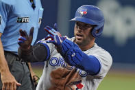 Toronto Blue Jays' George Springer celebrates after his triple off Tampa Bay Rays pitcher JT Chargois during the first inning of a baseball game Thursday, Sept. 22, 2022, in St. Petersburg, Fla. (AP Photo/Chris O'Meara)
