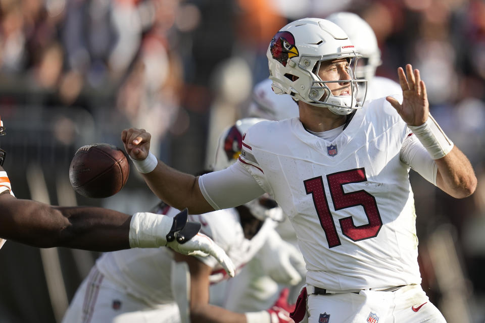 Arizona Cardinals quarterback Clayton Tune (15) fumbles the ball while being sacked by Cleveland Browns defensive tackle Shelby Harris during the second half of an NFL football game Sunday, Nov. 5, 2023, in Cleveland. The Browns recovered the fumble. (AP Photo/Sue Ogrocki)