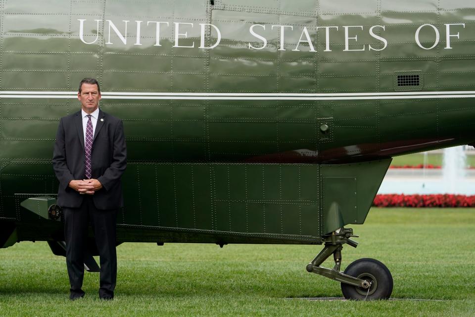 A member of the U.S. Secret Service stands guard outside Marine One, with President Joe Biden aboard, on the South Lawn of the White House, Wednesday, July 6, 2022, in Washington. Biden is traveling to Cleveland.