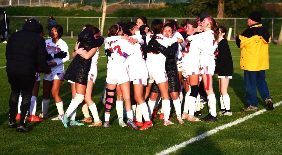 The Winters High girls soccer players celebrate after the Warriors defeated Hilmar in penalty kicks to win the NorCal Regional Division V championship on Saturday, March 2, 2024 at Hilmar High School.