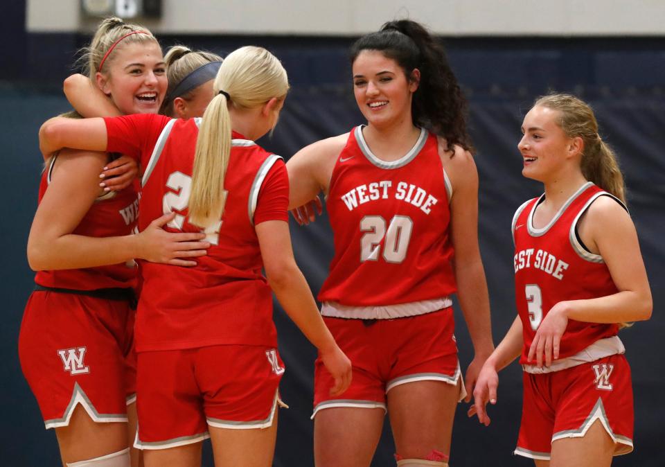 West Lafayette Red Devils Adrianne Tolen (10) celebrates with teammates after breaking the all-time scoring record during the IHSAA girl’s basketball game against the Central Catholic Knights, Tuesday, Jan. 9, 2024, at Central Catholic High School in Lafayette, Ind. Central Catholic won 64-56.