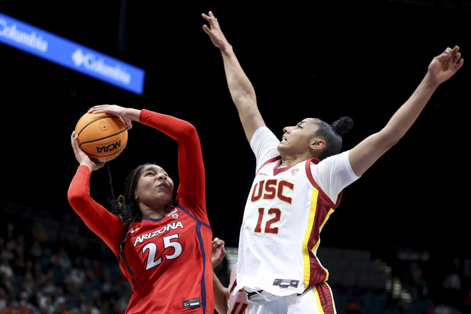 Arizona forward Breya Cunningham (25) shoots over Southern California guard JuJu Watkins (12) during the first half of an NCAA college basketball game in the quarterfinal round of the Pac-12 tournament Thursday, March 7, 2024, in Las Vegas. (AP Photo/Ian Maule)