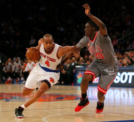 Dec 19, 2015; New York, NY, USA; New York Knicks guard Arron Afflalo (4) drives to the basket against Chicago Bulls forward Tony Snell (20) during the first half at Madison Square Garden. Mandatory Credit: Noah K. Murray-USA TODAY Sports