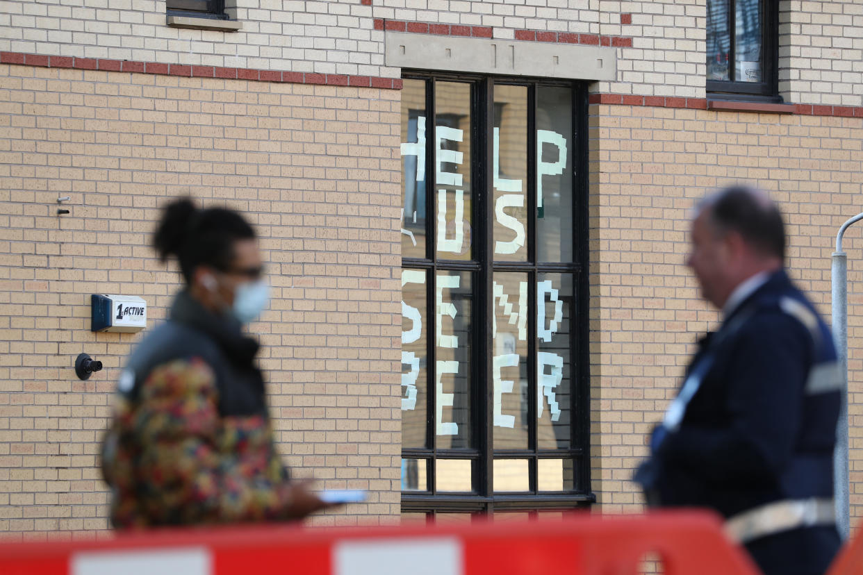 A sign saying 'help us, send beer' at Murano Street Student Village in Glasgow, where Glasgow University students are being tested at a pop up test centre. (PA)