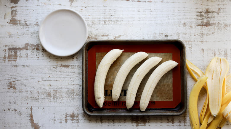 Raw bananas on sheet pan
