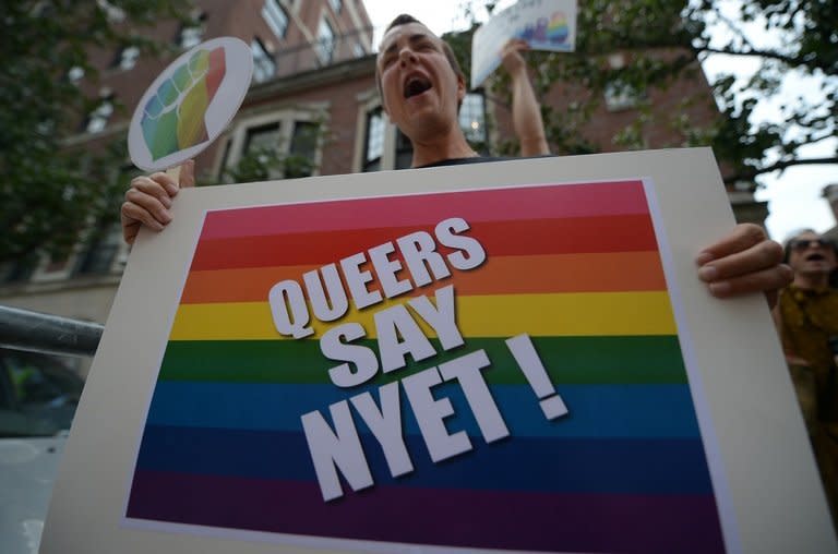 Protesters demonstrate against Russian anti-gay legislation in front of the Russian Consulate in New York on July 31, 2013. Russian government-funded TV channel RT was at the centre of a new controversy Thursday after taking an American journalist off air for launching into a diatribe against Russia's anti-gay legislation