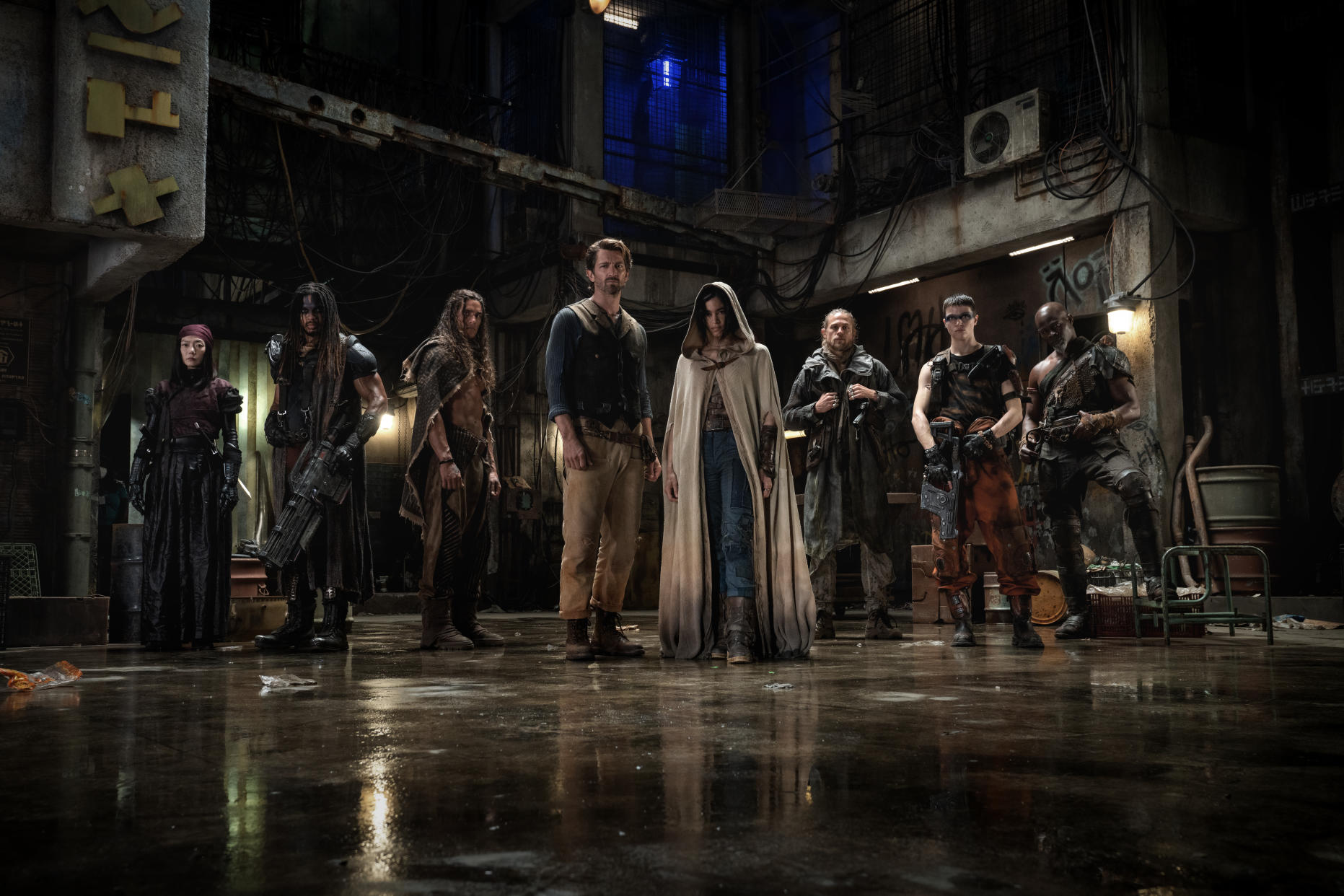 REBEL MOON: (L-R) Doona Bae as Nemesis, Ray Fisher as Bloodaxe, Staz Nair as Tarak, Michiel Huisman as Gunnar, Sofia Boutella as Kora, Charlie Hunnam as Kai, E. Duffy as Milius and Djimon Hounsou as Titus in Rebel Moon. (Netflix)