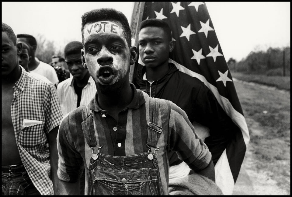 <p>Alabama, 1965. “From 1961 to 1965, I bore witness to various demonstrations in the civil rights movement. In this photograph, a group of civil rights demonstrators march from Selma to Montgomery to fight for the right to vote. Freedom was then, as it remains today, something that had to be fought for.” (© Bruce Davidson/Magnum Photos) </p>