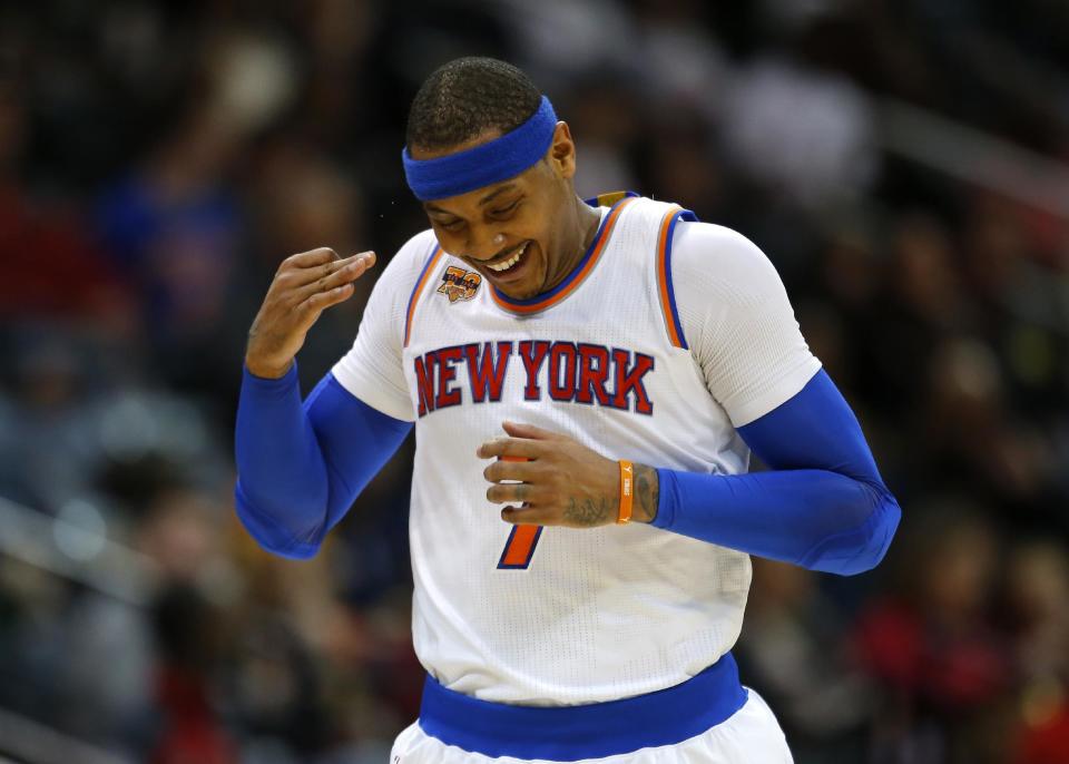 New York Knicks forward Carmelo Anthony (7) reacts after scoring a 3 pointer in the first half of an NBA basketball game against the Atlanta Hawks on Sunday, Jan. 29, 2017, in Atlanta. (AP Photo/Todd Kirkland)