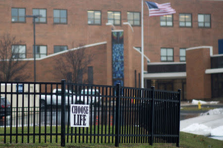 FILE PHOTO: An anti-abortion sign hangs on a fence in front of Covington Catholic High School in Park Hills, Kentucky, U.S., January 23, 2019. REUTERS/Madalyn McGarvey